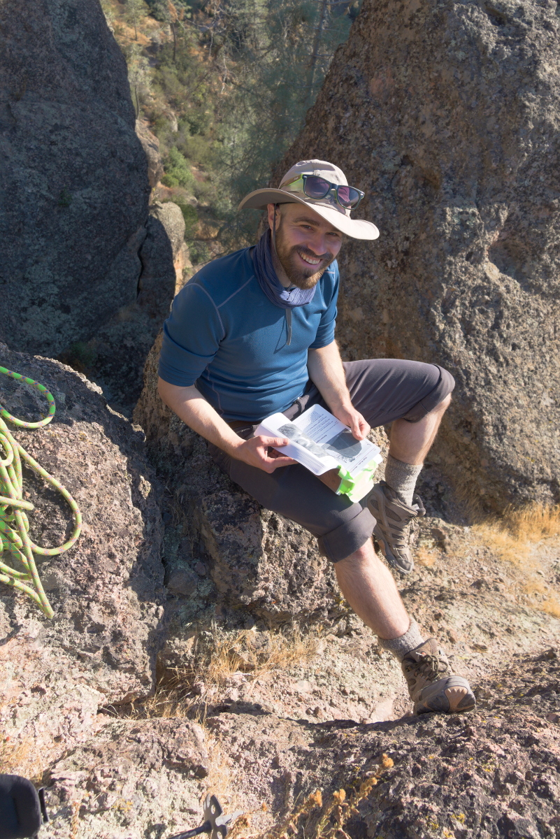 Brenton Salmi, KB1LQD, studying climbing routes.