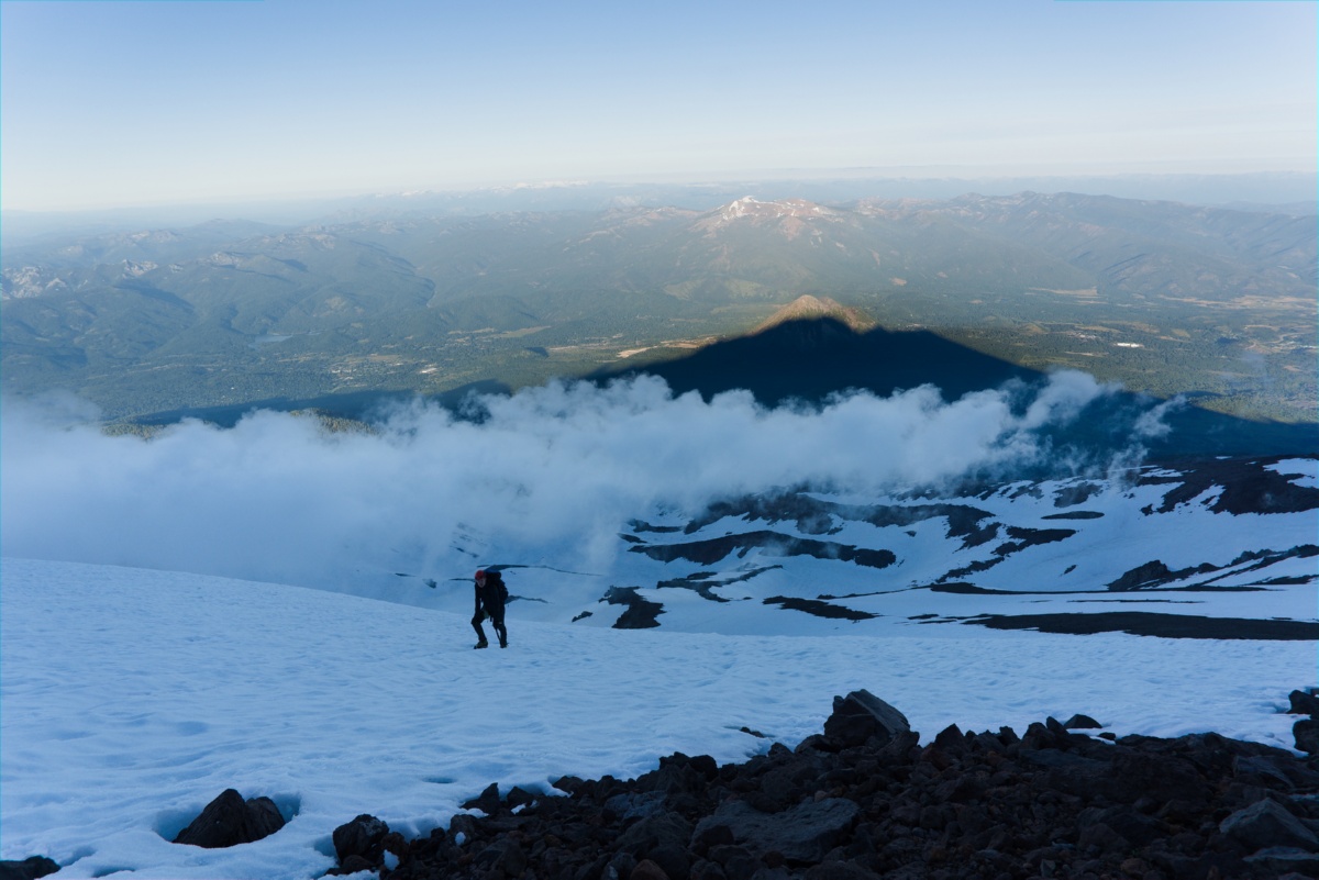 Looking down at my partner climbing the West Face route of Mt. Shasta.