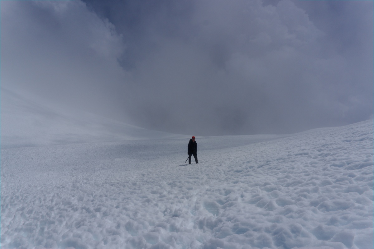 A photo of my climbing partner as thick clouds rolled in at the base of Misery Hill (Mt. Shasta).